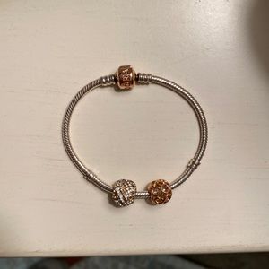 Pandora bracelet with two charms.